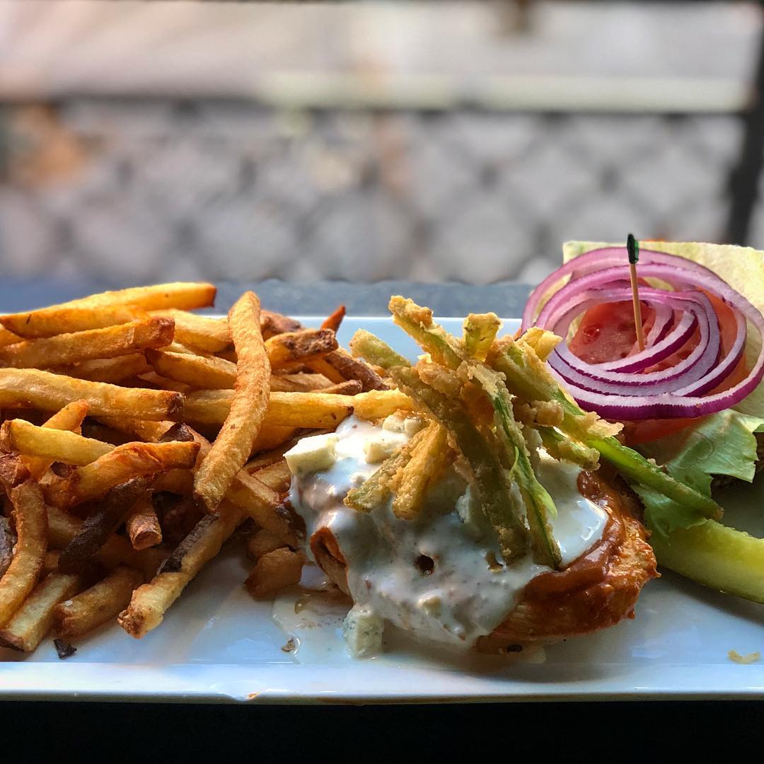 This week’s featured sandwich at @localwhiskeybar is the Pompous Bastard! ••• Grilled Chicken Breast tossed in Pompous sauce, Battered Celery, Lettuce, Tomato, Red Onion and Blue Cheese Dressing on a Salt and Pepper Bun! ••• #food #chicken #sandwich #hung